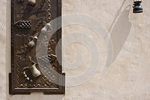 Dubai UAE Ornately decorated wood doors at Heritage Village in Bur Dubai