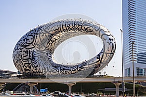 Dubai, UAE - 03.15.2021 Rope access workers working at heights, cleaning museum of the future building. Architecture