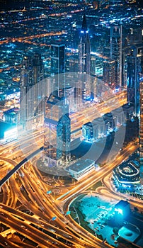 Dubai, UAE, United Arab Emirates - May 25, 2021: Aerial View Of Street Night Traffic Of Illuminated Cityscape With