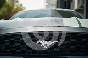 Dubai, UAE, United Arab Emirates - May 25, 2021: Close View Of Logo Logotype Sign Of Ford Mustang on grey hood. Ford