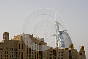 Dubai UAE world famous Burj Al Arab Hotel seen beyond old windtowers