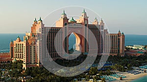 DUBAI, UNITED ARAB EMIRATES - DECEMBER 28, 2021. Low altitude aerial view of Atlantis The Palm luxury hotel