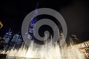 Burj Khalifa skyscraper illuminated at night and Fountain Show in Dubai