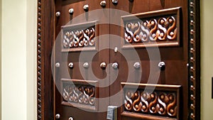 DUBAI, UNITED ARAB EMIRATES, UAE - NOVEMBER 20, 2017: Hotel Jumeirah Al Qasr Madinat , beautiful carved wooden doors in