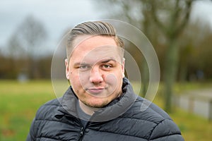 Dubious young man pullling a sceptical face