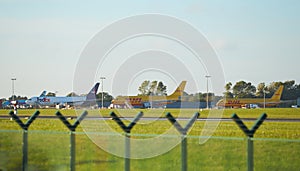 Dubli, Ireland - 10.11.2021: DHL airplane on the Dublin airport. Commercial airplane jetliner landing in beautiful sunset light. F