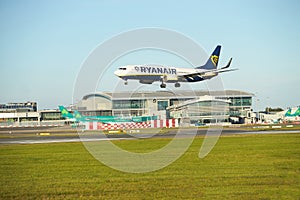 Dubli, Ireland - 10.11.2021: Ryanair airplane on the Dublin airport. Commercial airplane jetliner landing in beautiful sunset ligh