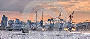 Dublin Harbor Port at sunset with cranes and ships