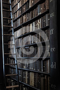 DUBLIN, IRELAND, DECEMBER 21, 2018: The Long Room in the Trinity College Library, home to The Book of Kells. A ladder to reach