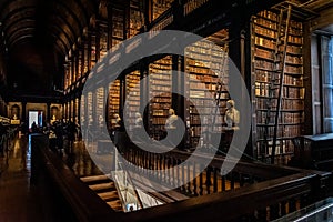 DUBLIN, IRELAND, DECEMBER 21, 2018: The Long Room in the Trinity College Library, home to The Book of Kells. Perspective view of photo