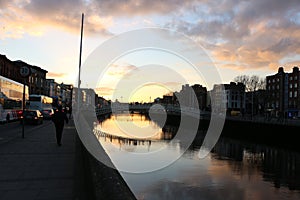 Dublin night scene with Ha`penny bridge and Liffey river lights . Ireland