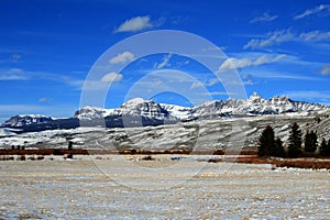 Dubois Wyoming Mountain Farming View of harvested Alfalfa field in front of the Absaroka Mountain Range