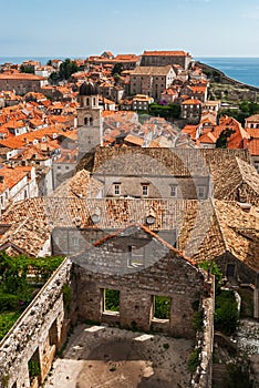 Dubrovnik city view with tower and riuned house