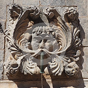 Dubrovnik, Croatia, 08.14.2022. Big fountain of Onofrio. A mascaron is a decorative element in the form of a mask of a