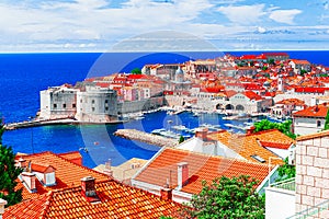 Dubrovnik, Croatia: Aerial view on the old town (medieval Ragusa) surrounded by fortified walls above the photo