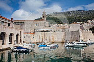 Dubrovnik city old port marina and fortifications in a beautiful early spring day