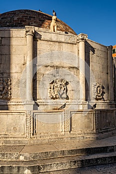 Dubrovnik, Croatia - Aug 22, 2020: Large Onofrio's Fountain in old town main street stradun