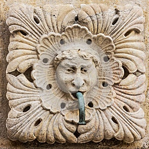 Dubrovnik, Croatia. Sculptural face on Onofrio`s fountain