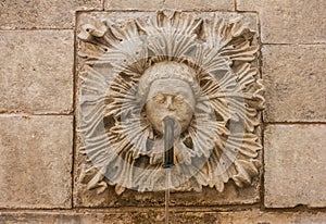 Dubrovnik, Croatia. Sculptural face on Onofrio`s fountain
