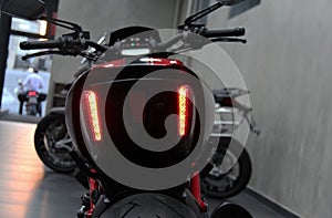 Ducati Diavel Carbon motorcycle. Close-up of the lit lanterns.