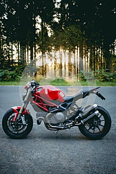 Ducati Monster motorcycle stopped on the side of the road  R