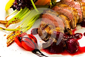 Duck baked with vegetables and herbs