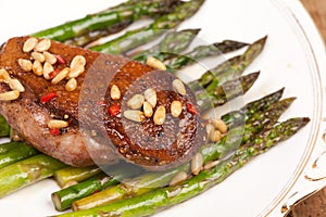 Duck breast with pine nuts and asparagus