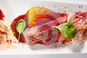 Duck breast with roasted plum dish top view