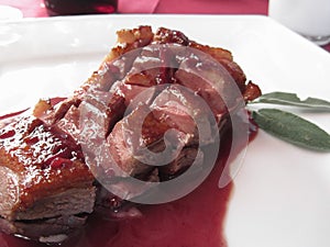 Duck breast on Sangiovese red wine sauce . Italian recipe