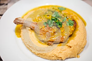 Duck confit and chickpea puree photo