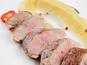 Duck fillet with apple sauce.