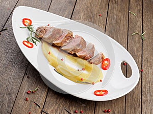 Duck fillet with apple sauce.