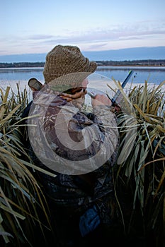 Duck Hunter In Blind Working a Call