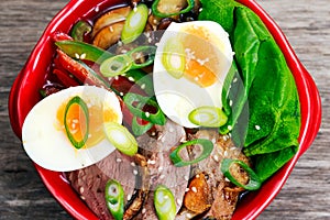 Duck noodles with egg and duck meat in bowl