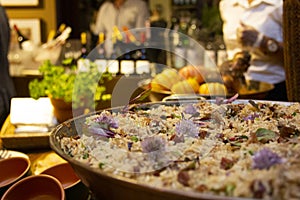 Duck rice with peas and spices in the pan