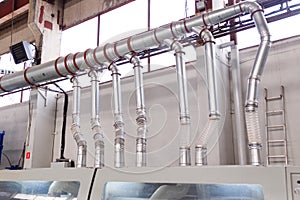 Ducts and pipes of an industrial aspiration system at a woodworking and sawmill factory.