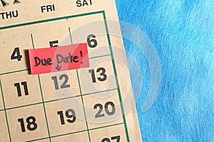 Due date and deadline reminder concept. Marked calendar date with note.