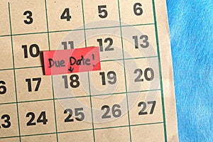 Due date and deadline reminder concept. Marked calendar date with note. photo