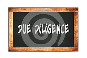 DUE  DILIGENCE text written on wooden frame school blackboard