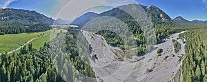 Due to the hot and dry summer and the climate change, the river bed of the Loisach in Bavaria is almost dried out, panorama from