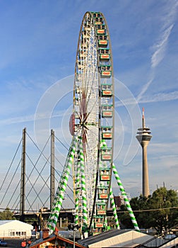 Duesseldorf Rhein carnival, ferris wheel and Rhine Tower