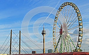 Duesseldorf Rhein carnival, ferris wheel and Rhine Tower