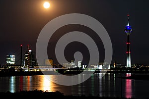 Duesseldorf and the Rhine Tower under the full moon