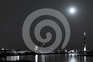 Duesseldorf and the Rhine Tower under the full moon in black and white