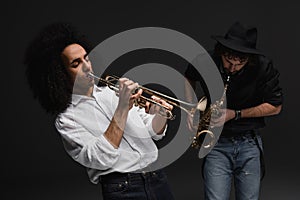 duet of musicians playing trumpet and sax