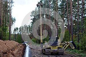 A Dug trench in the ground for the installation and installation of industrial gas and oil pipes.