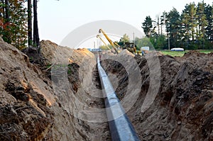 A Dug trench in the ground for the installation and installation of industrial gas and oil pipes.