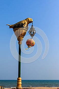 Dugong statue on electricity post