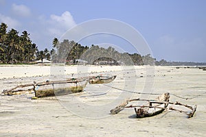Dugouts on the beach in Zanzibar photo