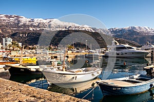 Dukley Marina, Budva, Montenegro: a sunbathing marina and snow-capped mountains